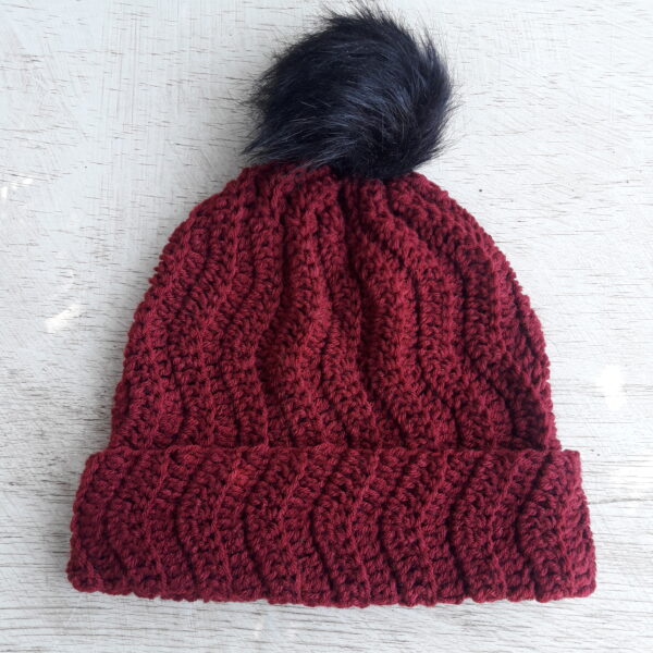 The Twist to the Classic Beanie uses simple stitches with intervals of increases and decreases to give is a nice wavy effect.